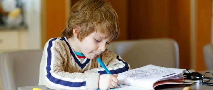 little boy colouring in