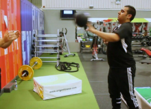 ben helping disabled person in the gym