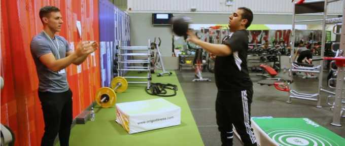 ben helping disabled person in the gym