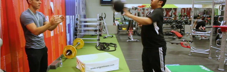 ben helping disabled person in the gym