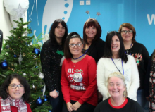 disabled living team photo wearing christmas jumpers