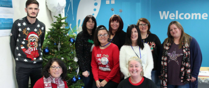 disabled living team photo wearing christmas jumpers