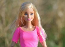 blonde barbie doll wearing pink top