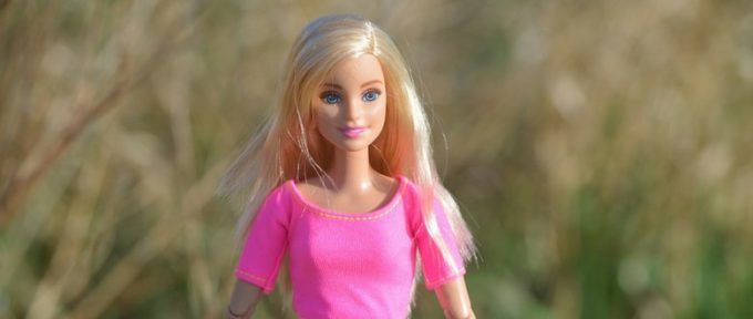 blonde barbie doll wearing pink top