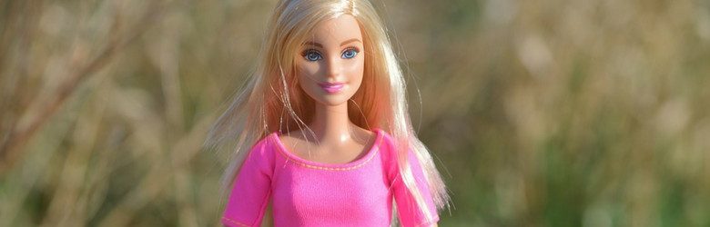 blonde barbie doll wearing pink top
