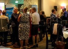 guests networking at disabled living's general meeting