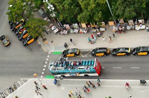 taxis and tour bus in the street of barcelona