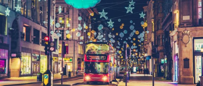 christmas outdoors in london with red bus approaching