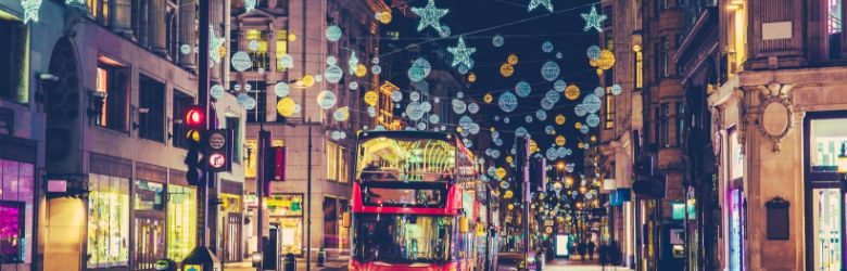 christmas outdoors in london with red bus approaching