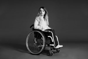 black and white photo of lady in wheelchair