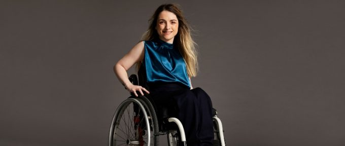 woman smiling in her wheelchair