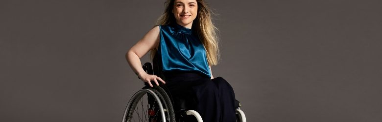 woman smiling in her wheelchair