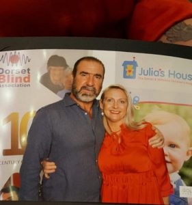 elisabeth and eric cantona smiling for photo