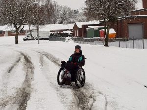 woman in wheelchair outside in the snow