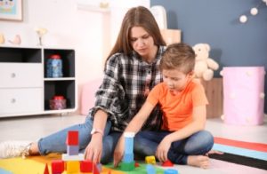 mother and son with building blocks