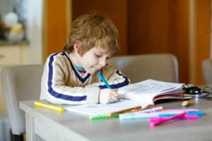 Young boy colouring in