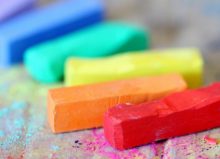 assorted coloured chalks on wood surface