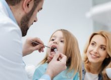 mum bringing child to the dentist