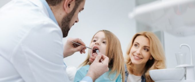 mum bringing child to the dentist