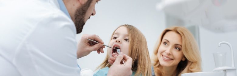 mum bringing child to the dentist