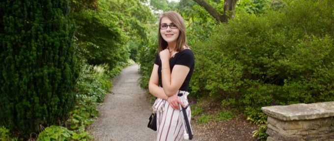 elin stood in front of trees and a path in the park