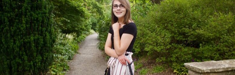 elin stood in front of trees and a path in the park