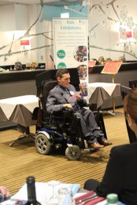 joshua wintersgill in his wheelchair presenting speech