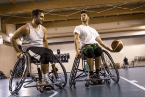 two disabled persons playing basketball