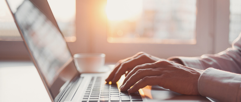 person typing on laptop