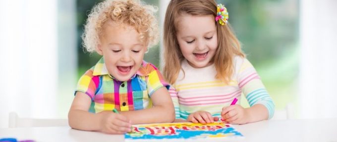 little boy and girl enjoying art at home