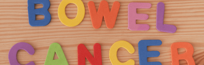 bowel cancer letters on wooden background