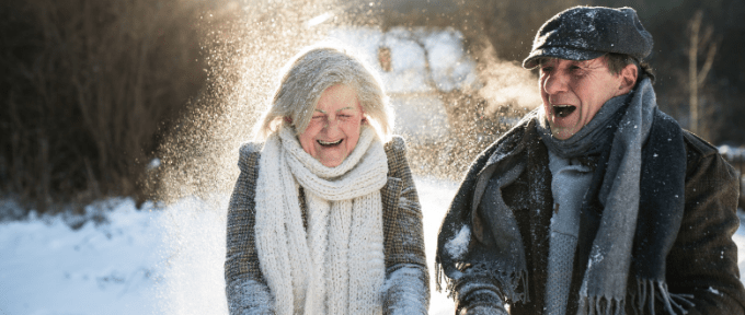 elderly couple in snow