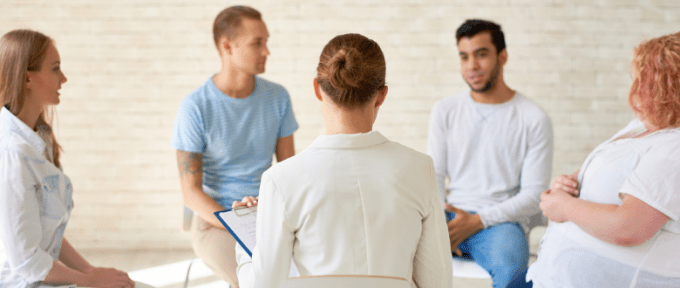 People sat in a group doing some training
