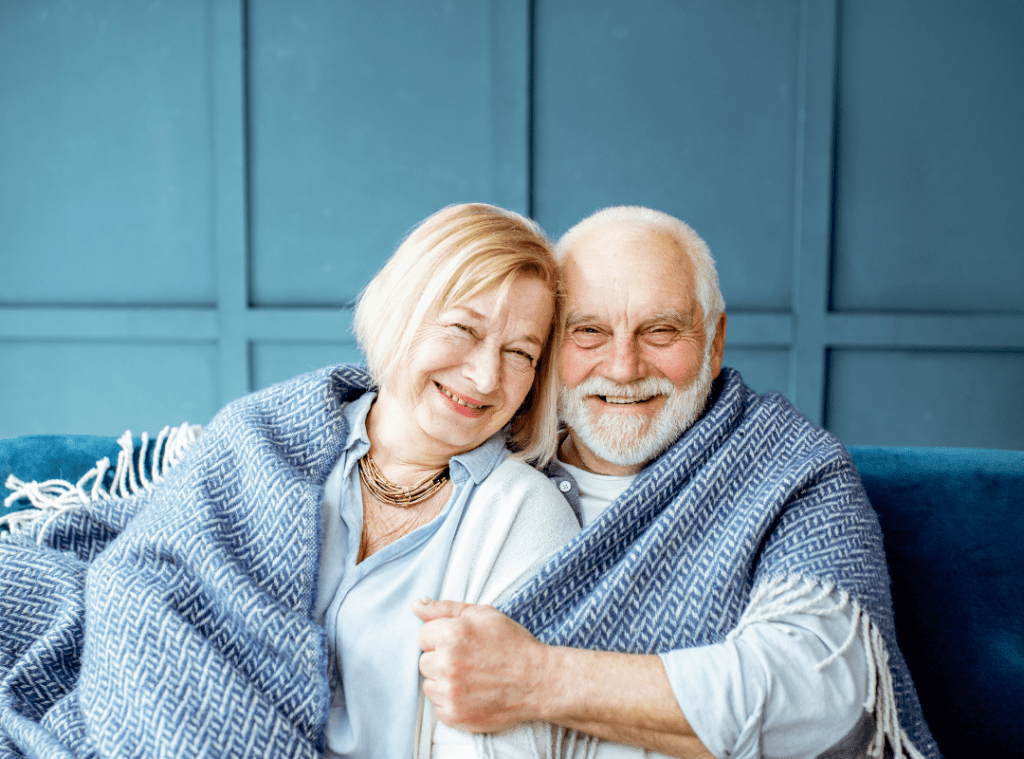 Elderly couple in blanket