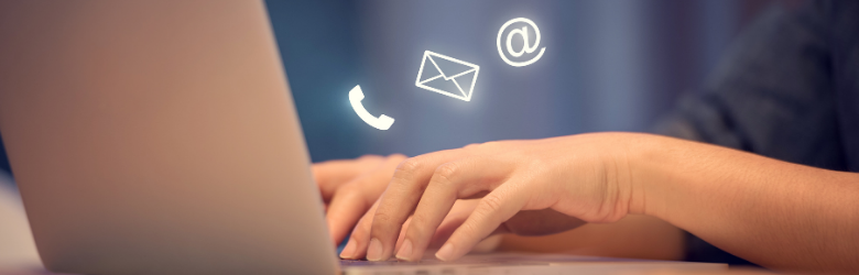 telephone and email icons near laptop screen