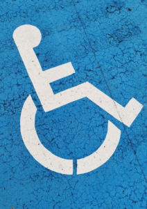 Blue flooring with white symbol from disabled parking space