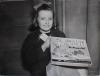 young girl holding Christmas present